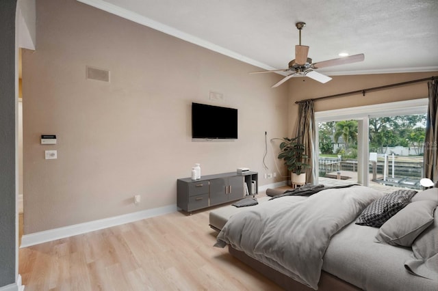 bedroom featuring light hardwood / wood-style floors, access to exterior, vaulted ceiling, ceiling fan, and crown molding