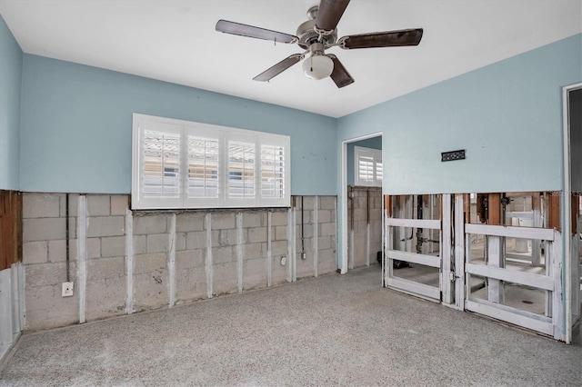 unfurnished room with ceiling fan