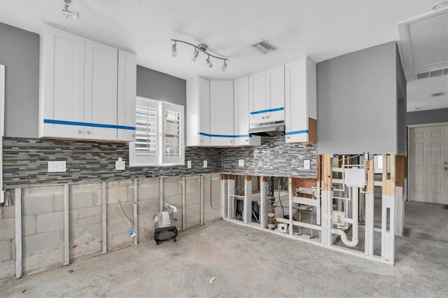 kitchen featuring white cabinets