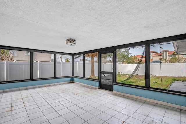 unfurnished sunroom with a healthy amount of sunlight