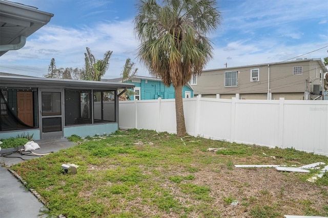 view of yard with a sunroom