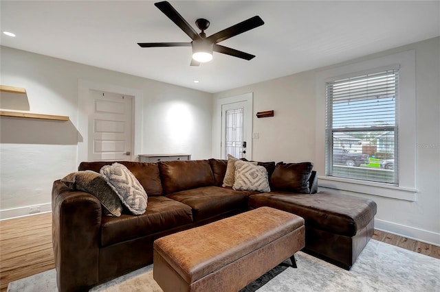 living area featuring light wood finished floors, baseboards, recessed lighting, and ceiling fan