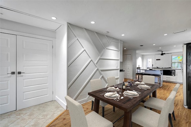 dining area featuring baseboards, visible vents, and recessed lighting