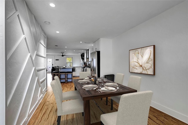 dining area featuring baseboards, recessed lighting, and light wood-style flooring