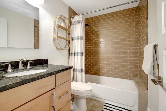full bath with tile patterned flooring, shower / tub combo with curtain, toilet, and vanity