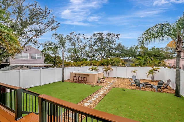 view of yard with a fenced backyard and a deck