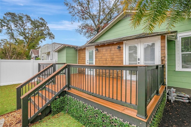 deck featuring fence and stairs
