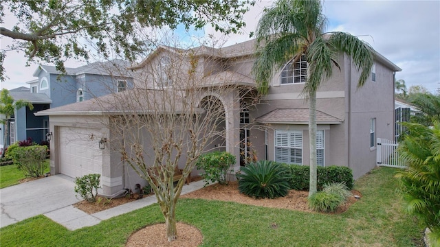 view of front facade featuring a garage and a front yard