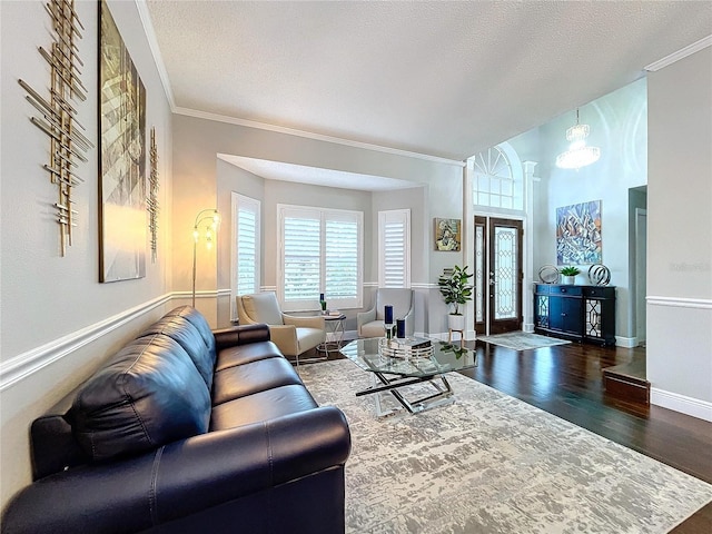 living room featuring crown molding, a textured ceiling, and dark hardwood / wood-style flooring