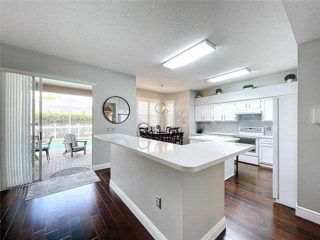 kitchen featuring white range with electric cooktop, white cabinetry, hanging light fixtures, a kitchen island, and dark hardwood / wood-style flooring