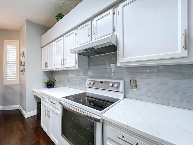 kitchen with dark hardwood / wood-style floors, tasteful backsplash, white cabinetry, white electric range oven, and light stone counters