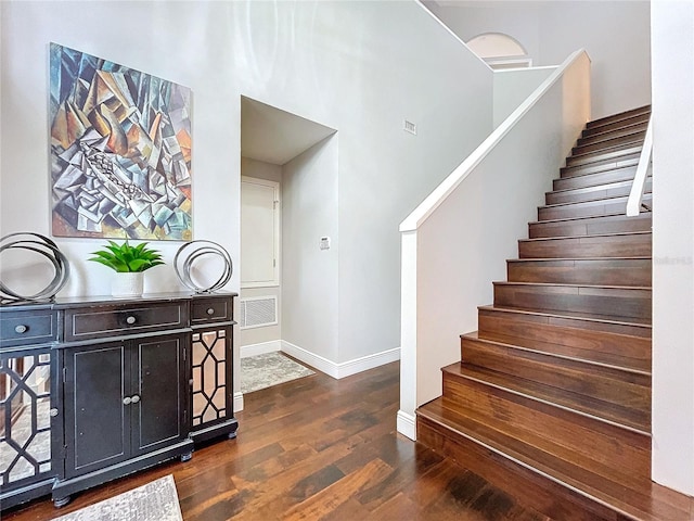 stairway featuring hardwood / wood-style flooring