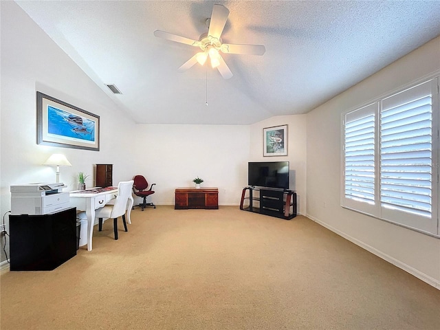 office with carpet floors, ceiling fan, vaulted ceiling, and a textured ceiling