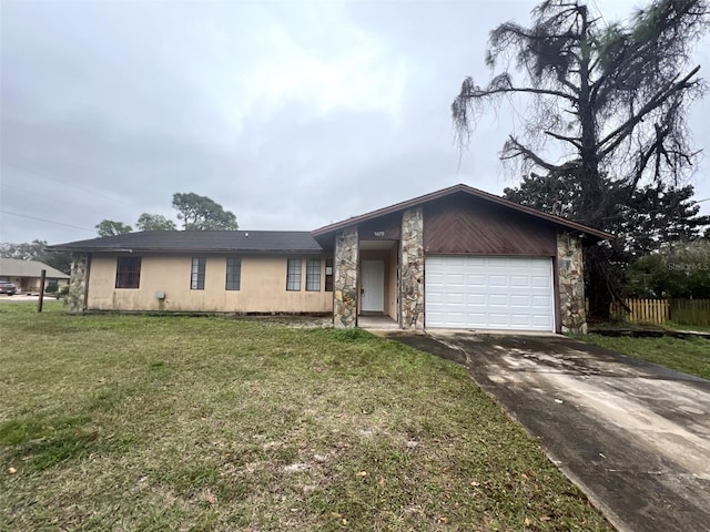 ranch-style house featuring a garage and a front yard