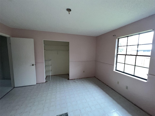 unfurnished bedroom with a closet