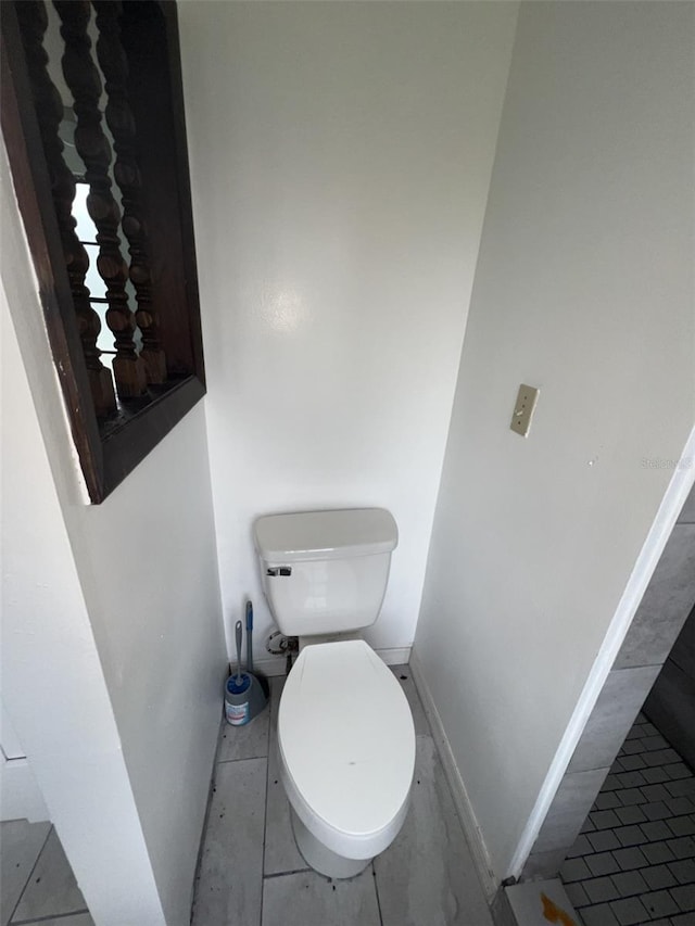 bathroom featuring tile patterned floors and toilet