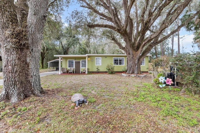 ranch-style home with a carport