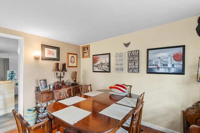 dining room with hardwood / wood-style floors