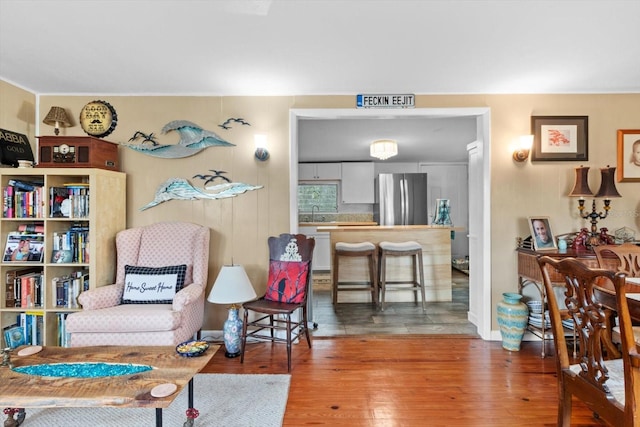 living area with hardwood / wood-style floors