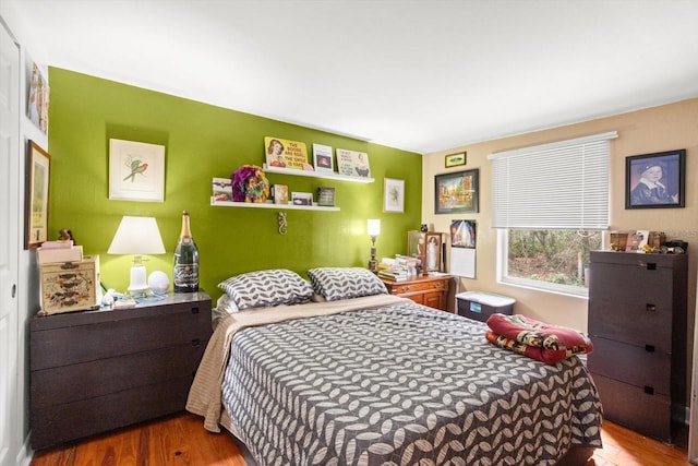 bedroom featuring wood-type flooring