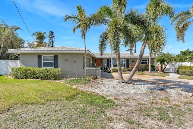 ranch-style home with a front yard