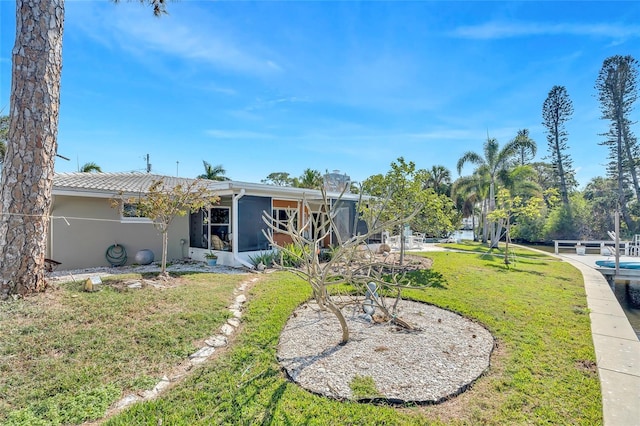 rear view of house with a yard