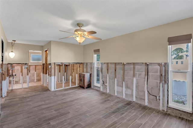 unfurnished room with ceiling fan and hardwood / wood-style floors