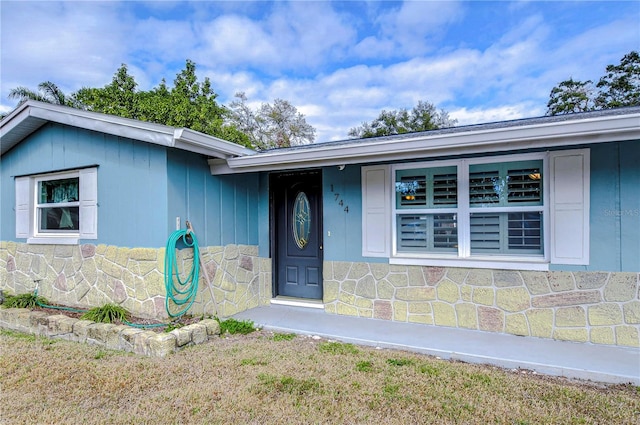 view of front of home with stone siding