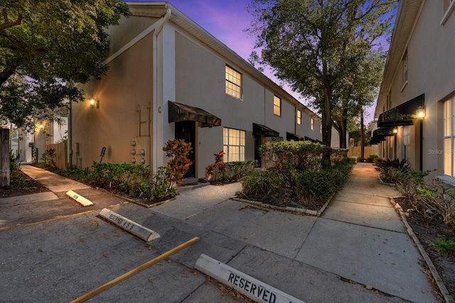 view of property exterior at dusk