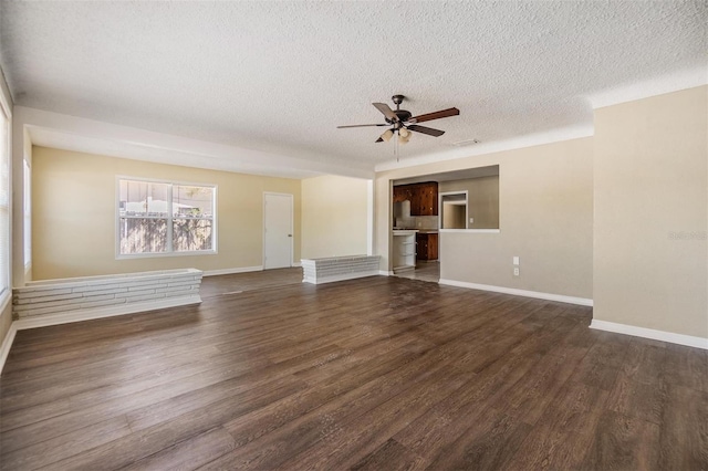 5130 Dr Martin Luther King Jr St S, Saint Petersburg, FL 33705 - unfurnished living room with dark wood finished floors, baseboards, a textured ceiling, and ceiling fan