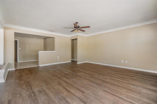 5130 Dr Martin Luther King Jr St S, Saint Petersburg, FL 33705 - spare room with baseboards, ceiling fan, and wood finished floors