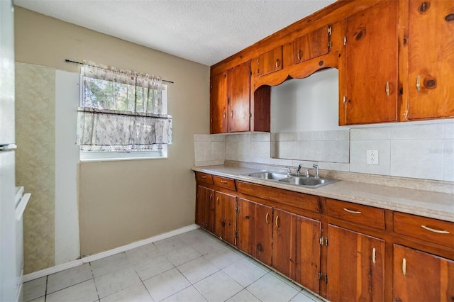 5130 Dr Martin Luther King Jr St S, Saint Petersburg, FL 33705 - kitchen with a sink, decorative backsplash, brown cabinetry, and light countertops