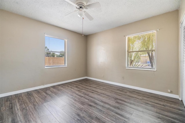 5130 Dr Martin Luther King Jr St S, Saint Petersburg, FL 33705 - empty room featuring a ceiling fan, wood finished floors, baseboards, and a textured ceiling