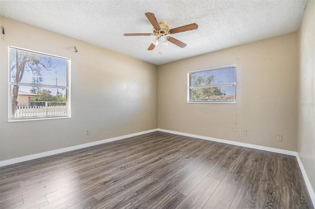 5130 Dr Martin Luther King Jr St S, Saint Petersburg, FL 33705 - spare room with a textured ceiling, a ceiling fan, baseboards, and wood finished floors