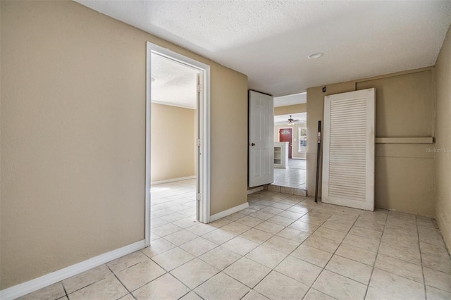 5130 Dr Martin Luther King Jr St S, Saint Petersburg, FL 33705 - unfurnished bedroom featuring light tile patterned flooring, baseboards, and a textured ceiling