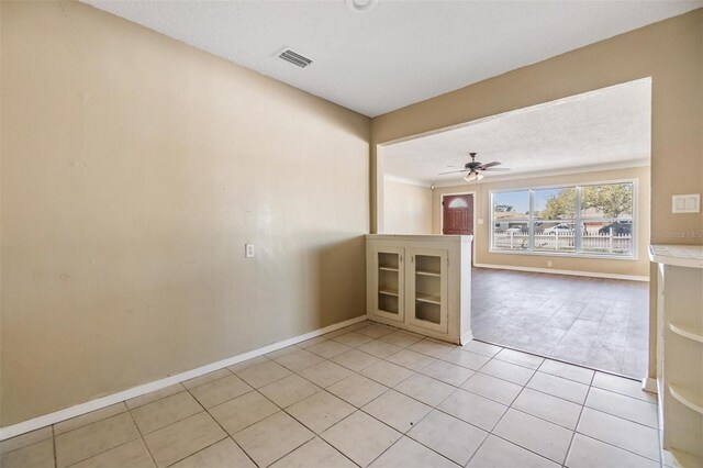 5130 Dr Martin Luther King Jr St S, Saint Petersburg, FL 33705 - spare room with light tile patterned floors, visible vents, baseboards, and a ceiling fan