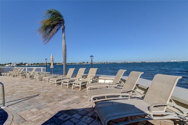 view of patio featuring a water view