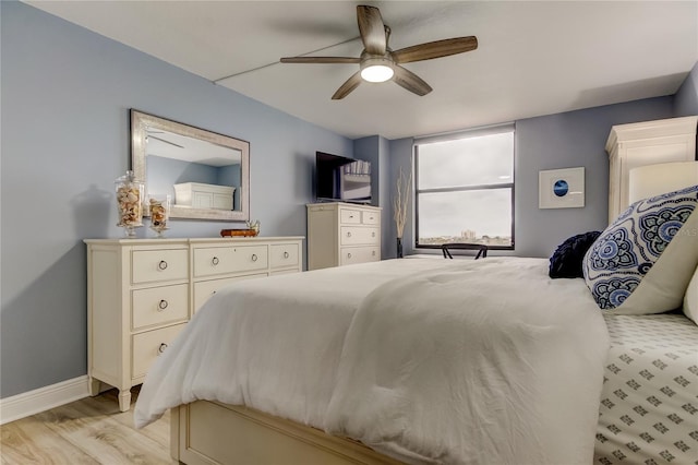 bedroom featuring light hardwood / wood-style flooring and ceiling fan