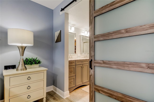 bathroom featuring vanity and hardwood / wood-style floors