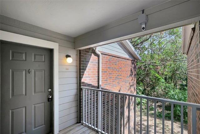 doorway to property featuring a balcony