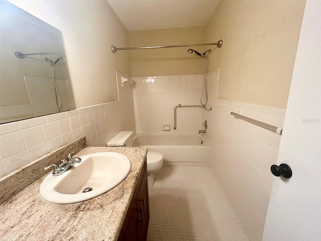 full bathroom with toilet, tile walls, tile patterned flooring, shower / tub combination, and vanity