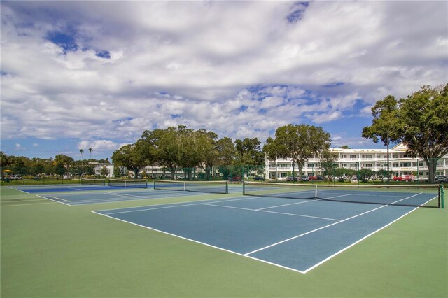 view of sport court featuring fence