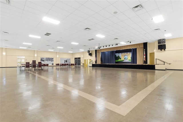 miscellaneous room featuring visible vents and track lighting