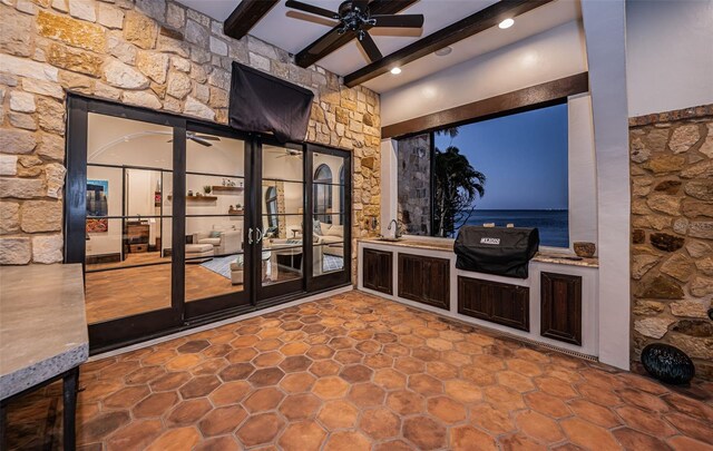 view of patio / terrace featuring ceiling fan, french doors, and a grill