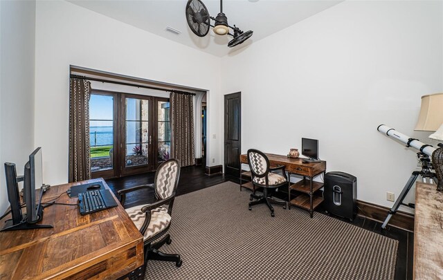 office with french doors, dark wood-type flooring, visible vents, and baseboards