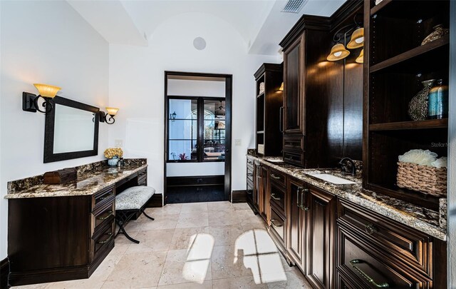 full bath featuring visible vents, vaulted ceiling, vanity, and baseboards