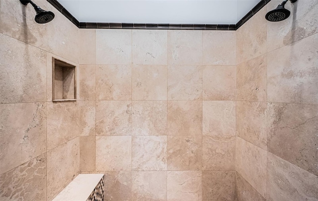 room details featuring a tile shower