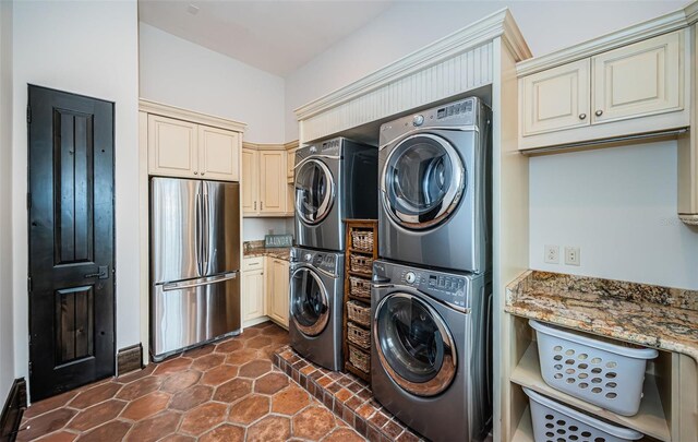 laundry room featuring stacked washer and dryer