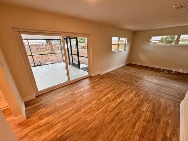 unfurnished room featuring light hardwood / wood-style floors