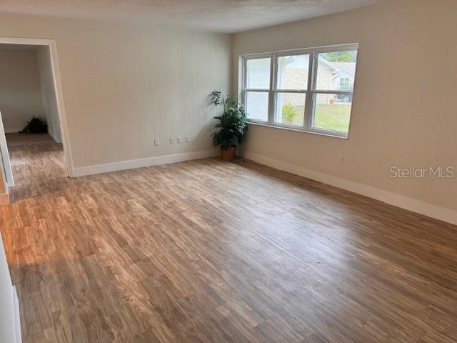 unfurnished room featuring hardwood / wood-style floors